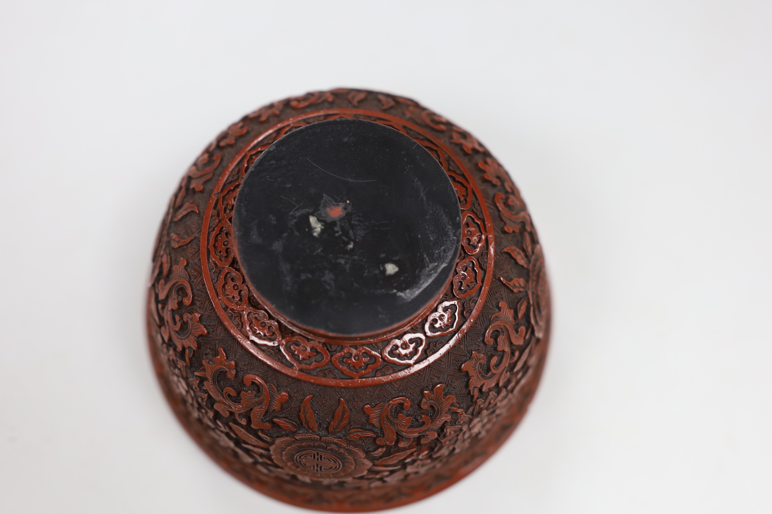 A Chinese red lacquer bowl and a Chinese overlaid glass vase, 17cm